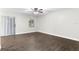 Bright living room featuring wood-look floors and ceiling fan at 4803 S Texas Ave # B, Orlando, FL 32839