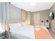 Serene bedroom featuring a comfortable bed, soft lighting, and a minimalist aesthetic at 7944 Formosa Valley Pl, Kissimmee, FL 34747