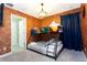 Unique bunk bedroom with brick accent wall, industrial-style lighting, and comfortable bedding at 7944 Formosa Valley Pl, Kissimmee, FL 34747