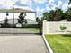 Exterior view of the community gate and sign, featuring well-maintained landscaping at 7944 Formosa Valley Pl, Kissimmee, FL 34747