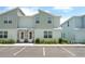 Charming townhome featuring a stone facade, double front doors, and a well-maintained landscape at 7944 Formosa Valley Pl, Kissimmee, FL 34747