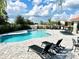 Community pool with plenty of seating for residents and their guests at 7944 Formosa Valley Pl, Kissimmee, FL 34747