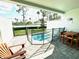 Private patio featuring a small pool with safety fencing and a relaxing outdoor seating area at 7944 Formosa Valley Pl, Kissimmee, FL 34747