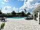Beautiful community swimming pool with chairs, tables and lounging chairs at 7944 Formosa Valley Pl, Kissimmee, FL 34747