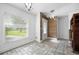 Bright and airy entryway with wood-look wall and tile flooring at 1713 Longleaf Dr, Saint Cloud, FL 34769