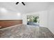 Bright living room with sliding doors leading to a patio at 1713 Longleaf Dr, Saint Cloud, FL 34769