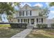 Two-story house with a front porch and landscaped yard at 1020 Wisconsin Ave, Saint Cloud, FL 34769