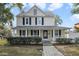 Two-story house with a front porch and landscaped yard at 1020 Wisconsin Ave, Saint Cloud, FL 34769