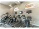 Well-equipped fitness center featuring treadmills, stair climbers, and multiple wall-mounted TVs for convenience at 2134 Osprey Woods Cir, Orlando, FL 32820