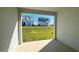 View of the backyard and neighboring homes from the covered lanai at 14771 Erice Ave, Clermont, FL 34714