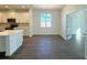 Dining area with ample natural light open to the kitchen, and view of the study at 14771 Erice Ave, Clermont, FL 34714