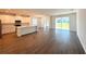 Open-concept living space featuring tile floors, ample natural light, and access to the backyard at 14771 Erice Ave, Clermont, FL 34714