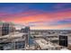 Stunning aerial view of the cityscape showcasing sleek modern buildings and a horizon bathed in the colors of the sunset at 155 S Court Ave # 2710, Orlando, FL 32801