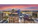 Orlando's downtown buildings stand tall against the sunset sky in this aerial view at 155 S Court Ave # 2710, Orlando, FL 32801