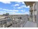 Balcony view overlooking a vibrant city skyline under a bright, cloudy sky at 155 S Court Ave # 2710, Orlando, FL 32801