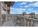 Wide balcony view of city featuring high-rise buildings and bright, cloudy skies at 155 S Court Ave # 2710, Orlando, FL 32801