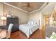 Comfortable bedroom with hardwood floors, neutral paint, and stylish ceiling fan at 155 S Court Ave # 2710, Orlando, FL 32801