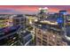 Striking night view of city skyline featuring modern buildings with vibrant lights at 155 S Court Ave # 2710, Orlando, FL 32801