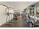 Modern gym with extensive equipment, including treadmills, weight machines, and free weights, under bright lighting at 155 S Court Ave # 2710, Orlando, FL 32801