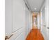 Hallway with hardwood floors, storage closet and leads to bathroom at 155 S Court Ave # 2710, Orlando, FL 32801