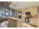 Open concept kitchen with stainless steel appliances, granite countertops, and breakfast bar overlooking the living area at 155 S Court Ave # 2710, Orlando, FL 32801