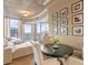 Cozy living room with neutral colors, tile floors, and large windows offering stunning city views at 155 S Court Ave # 2710, Orlando, FL 32801