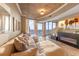Inviting living room with a large sectional sofa, fireplace, and expansive windows showcasing beautiful city views at 155 S Court Ave # 2710, Orlando, FL 32801