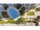 Overhead view of community pool and landscaping with comfortable lounge seating at 155 S Court Ave # 2710, Orlando, FL 32801