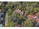 Aerial view of townhouses nestled in a wooded area at 203 Tomoka Trl # 203, Longwood, FL 32779