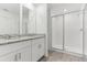 Bathroom featuring double vanity and glass-door walk-in shower at 4308 Ranch House Rd, Saint Cloud, FL 34772