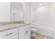 Well-lit bathroom with granite countertop vanity and shower-tub combo at 4308 Ranch House Rd, Saint Cloud, FL 34772