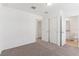 Bright bedroom featuring neutral carpet, closet, and ensuite bathroom at 4308 Ranch House Rd, Saint Cloud, FL 34772