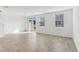 Bright living room with tile floors, light walls, and a sliding glass door to the backyard at 4308 Ranch House Rd, Saint Cloud, FL 34772