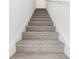 Staircase with carpeted steps and white walls and trim leading to the second floor at 4308 Ranch House Rd, Saint Cloud, FL 34772