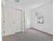 Bedroom featuring plush carpet, a double door closet, and a window with blinds at 4316 Ranch House Rd, Saint Cloud, FL 34772