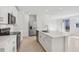 Well-lit kitchen featuring updated appliances, island, and bright white cabinetry at 4316 Ranch House Rd, Saint Cloud, FL 34772