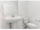 Half bathroom with a pedestal sink and white fixtures at 4320 Ranch House Rd, Saint Cloud, FL 34772