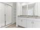 Modern bathroom features granite counters, double sinks and a glass shower at 4320 Ranch House Rd, Saint Cloud, FL 34772