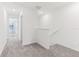 Bright upstairs hallway with carpet floors at 4320 Ranch House Rd, Saint Cloud, FL 34772