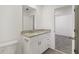 Bathroom with modern vanity, granite countertop, brushed nickel fixtures, and tile flooring at 4368 Ranch House Rd, Saint Cloud, FL 34772