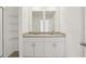 Elegant bathroom vanity with dual sinks, granite countertop, and modern fixtures at 4368 Ranch House Rd, Saint Cloud, FL 34772