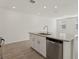 Bright kitchen island features granite counters, stainless steel dishwasher, and a modern faucet at 4368 Ranch House Rd, Saint Cloud, FL 34772