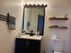 Well-lit bathroom featuring a vanity, toilet, and shelves for storage at 1909 Summer Club Dr # 307, Oviedo, FL 32765