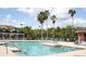 Resort-style community pool surrounded by lush greenery, perfect for relaxation and recreation at 1909 Summer Club Dr # 307, Oviedo, FL 32765