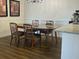 Cozy dining room featuring a wood table with four chairs, perfect for Gathering meals at 1909 Summer Club Dr # 307, Oviedo, FL 32765
