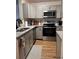 Modern kitchen with stainless steel appliances and granite countertops at 1909 Summer Club Dr # 307, Oviedo, FL 32765