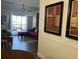 Inviting living room with a comfortable red couch and access to a serene outdoor balcony at 1909 Summer Club Dr # 307, Oviedo, FL 32765