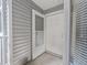 Inviting front entry featuring a storm door, white exterior, and neutral siding at 2246 Stonington Ave # 2246, Orlando, FL 32817