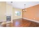 Bright living room with a fireplace, hardwood floors, and neutral paint at 2246 Stonington Ave # 2246, Orlando, FL 32817