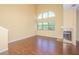 Open living room with high ceilings, a fireplace, and hardwood floors at 2246 Stonington Ave # 2246, Orlando, FL 32817